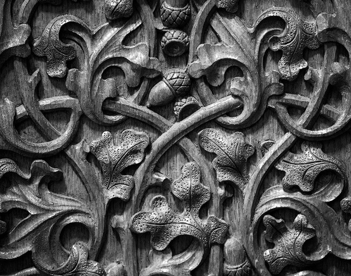 An image showing the detail of the oak-inspired carving in the Speaker’s Chair.